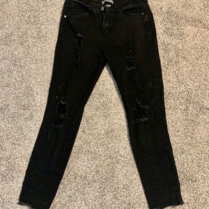 Black distressed jeans.